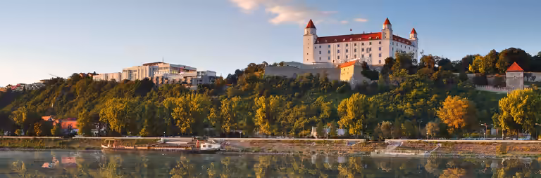 Bratislava castle with reflection in river Danube